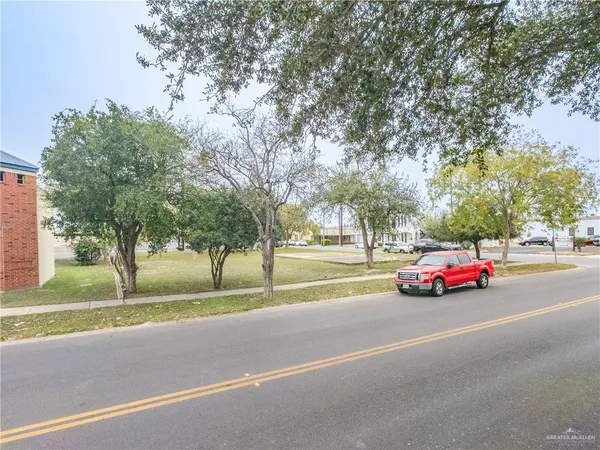 a view of street with parked cars