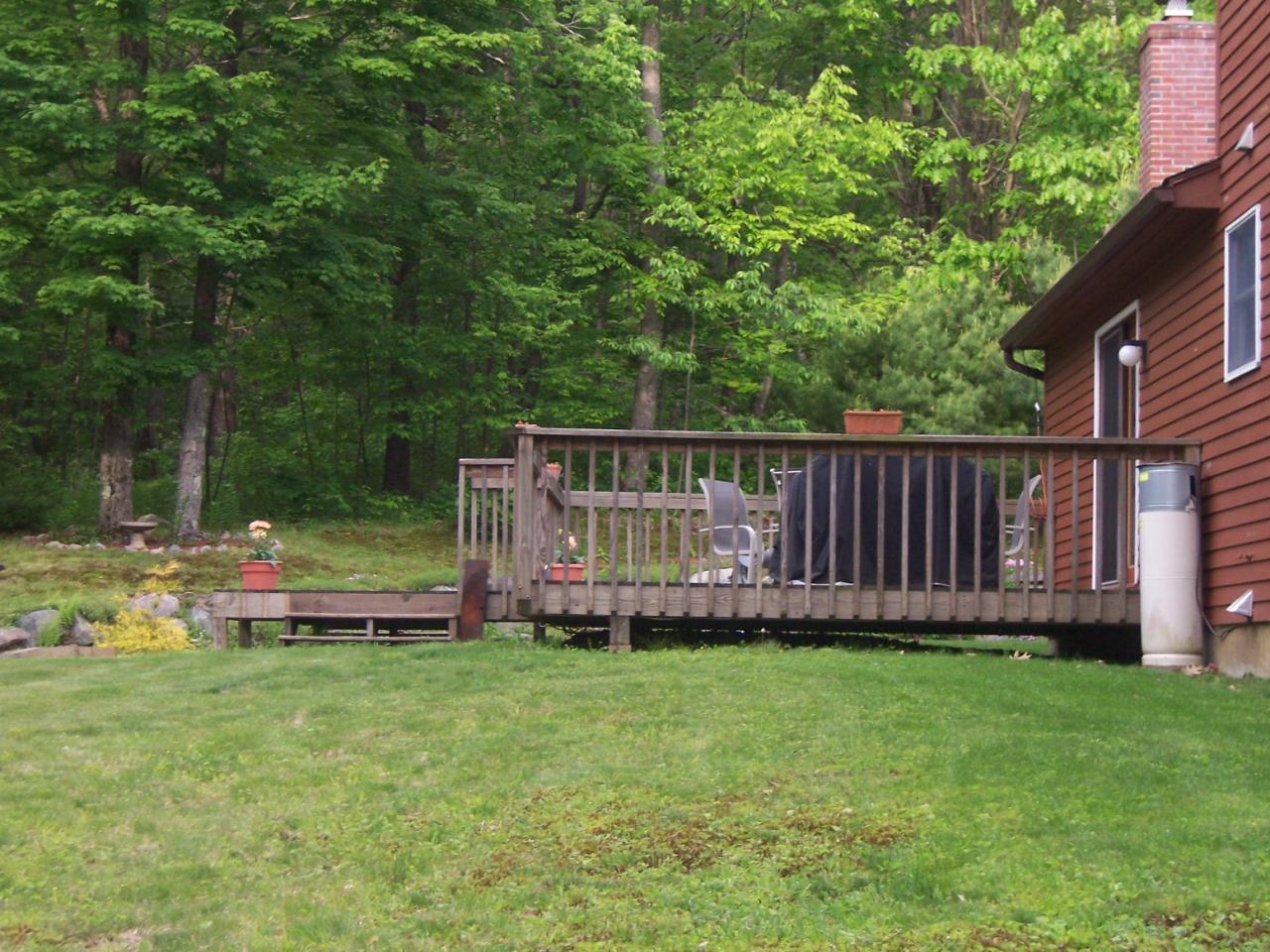 1304 George Carter Road Becket, MA 01223 - Photo 3 of 12 a view of a deck with a tiny house