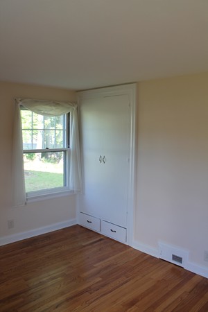 926 Plumtree Road Springfield, MA 01119 - Photo 11 of 21 an empty room with wooden floor and windows