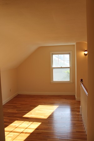 926 Plumtree Road Springfield, MA 01119 - Photo 18 of 21 a view of an empty room with wooden floor and a window