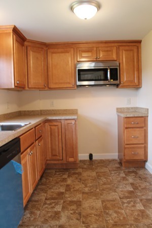 926 Plumtree Road Springfield, MA 01119 - Photo 4 of 21 a kitchen with stainless steel appliances granite countertop a refrigerator and a stove top oven