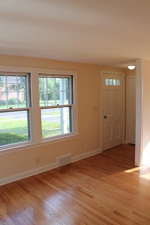 926 Plumtree Road Springfield, MA 01119 - Photo 7 of 21 an empty room with wooden floor and windows