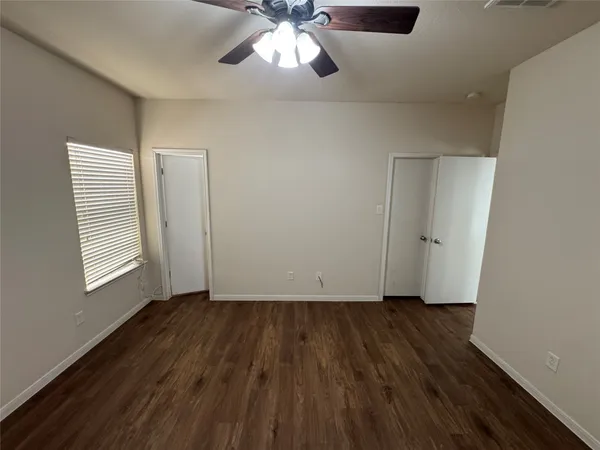 a bathroom with a sink a toilet a mirror and shower