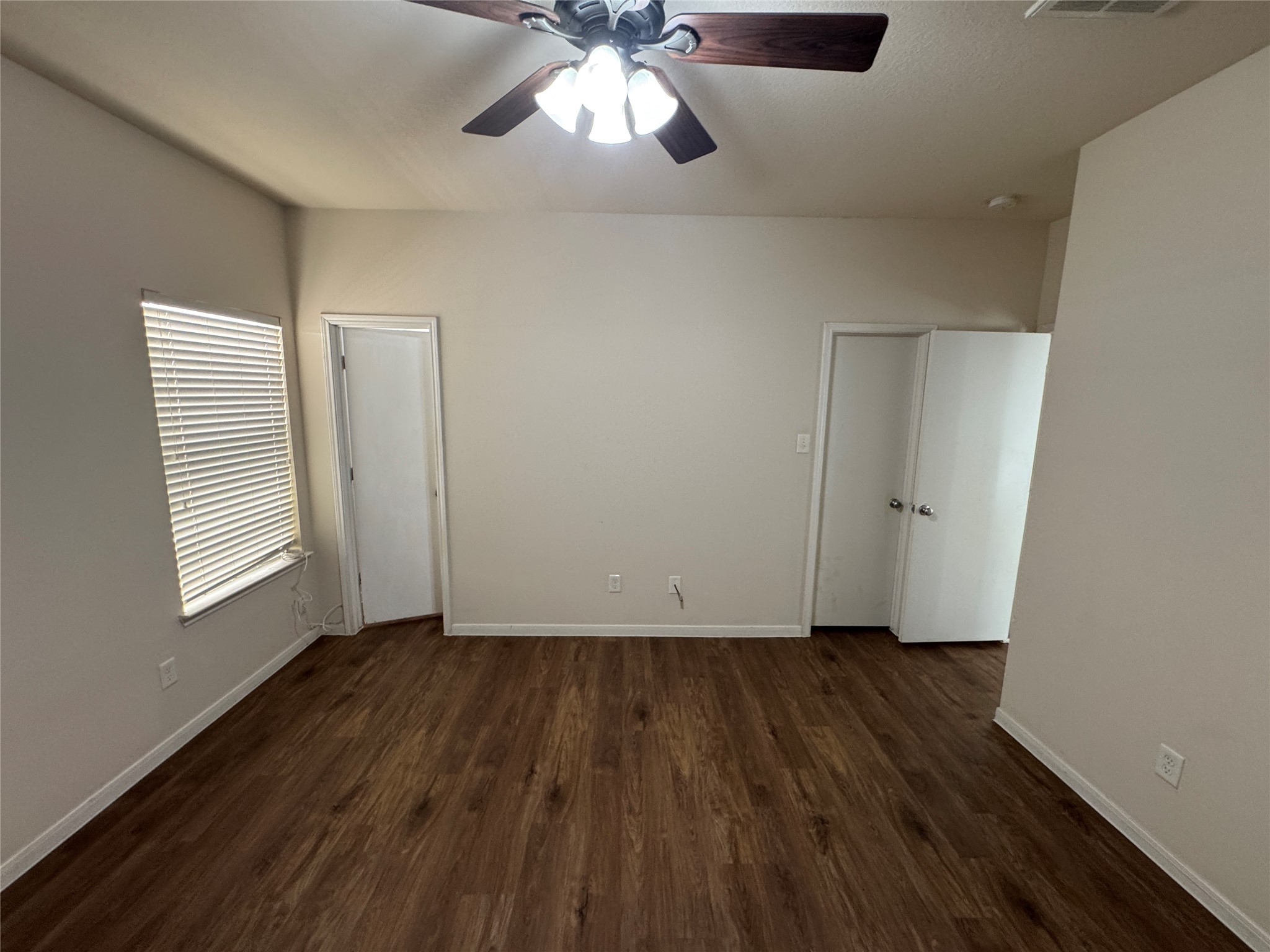 21719 Mossy Field Lane Spring, TX 77388 - Photo 20 of 44 an empty room with wooden floor chandelier fan and windows