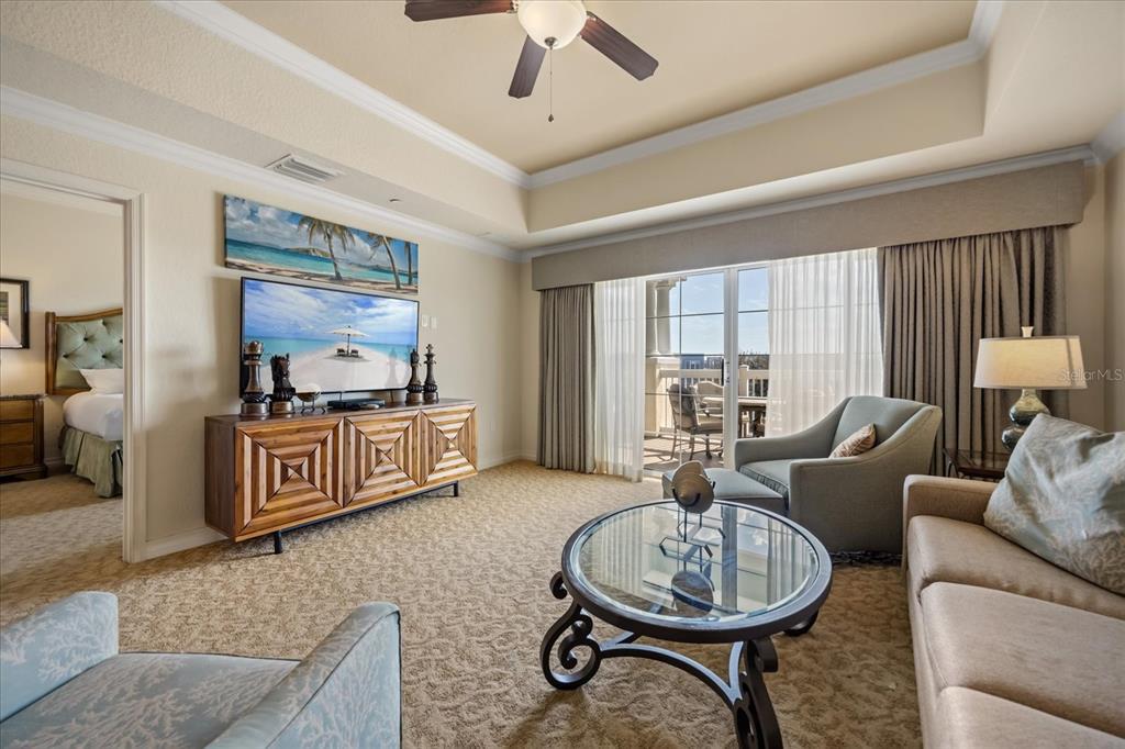1114 Sunset View Circle, Unit 402 Reunion, FL 34747 - Photo 2 of 32 a living room with furniture a flat screen tv and a large window