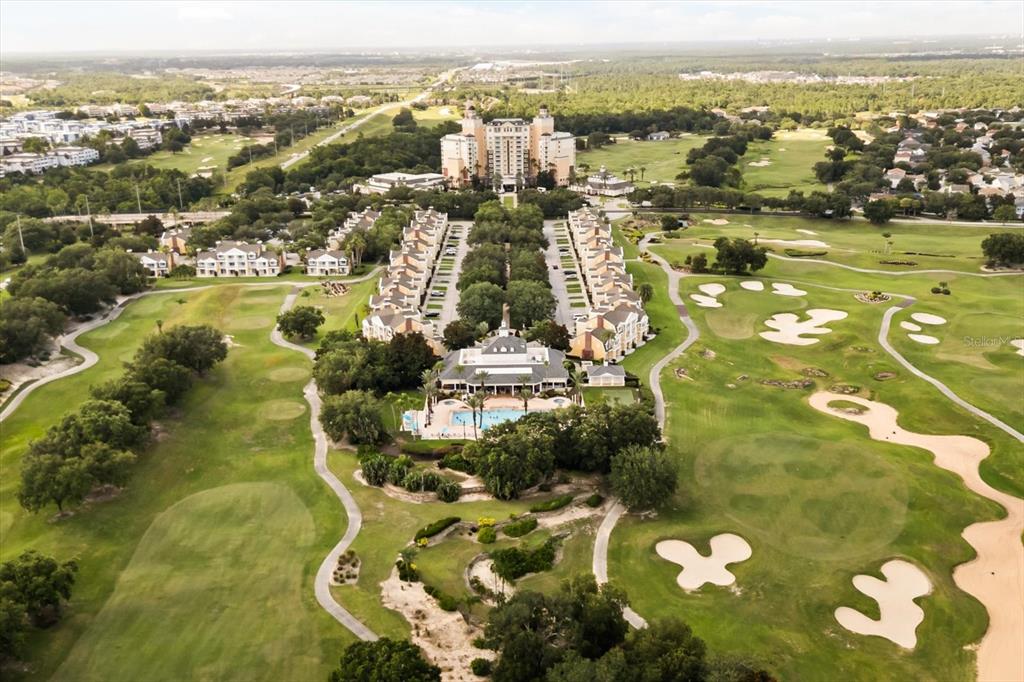 1114 Sunset View Circle, Unit 402 Reunion, FL 34747 - Photo 22 of 32 an aerial view of residential houses with outdoor space