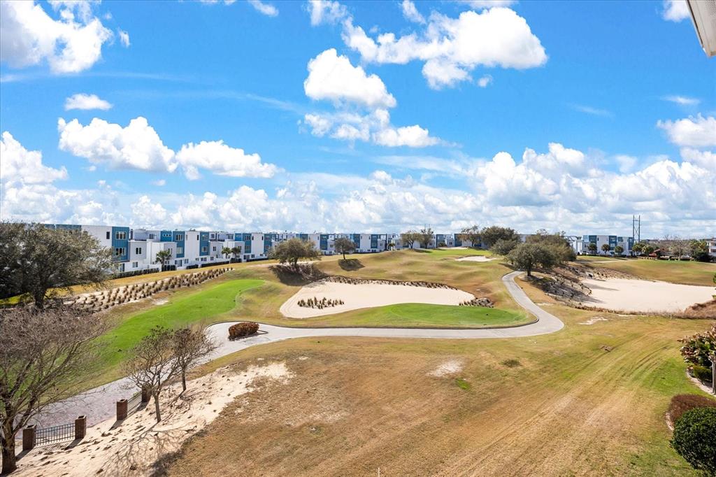 1114 Sunset View Circle, Unit 402 Reunion, FL 34747 - Photo 23 of 32 a view of a swimming pool with an outdoor seating