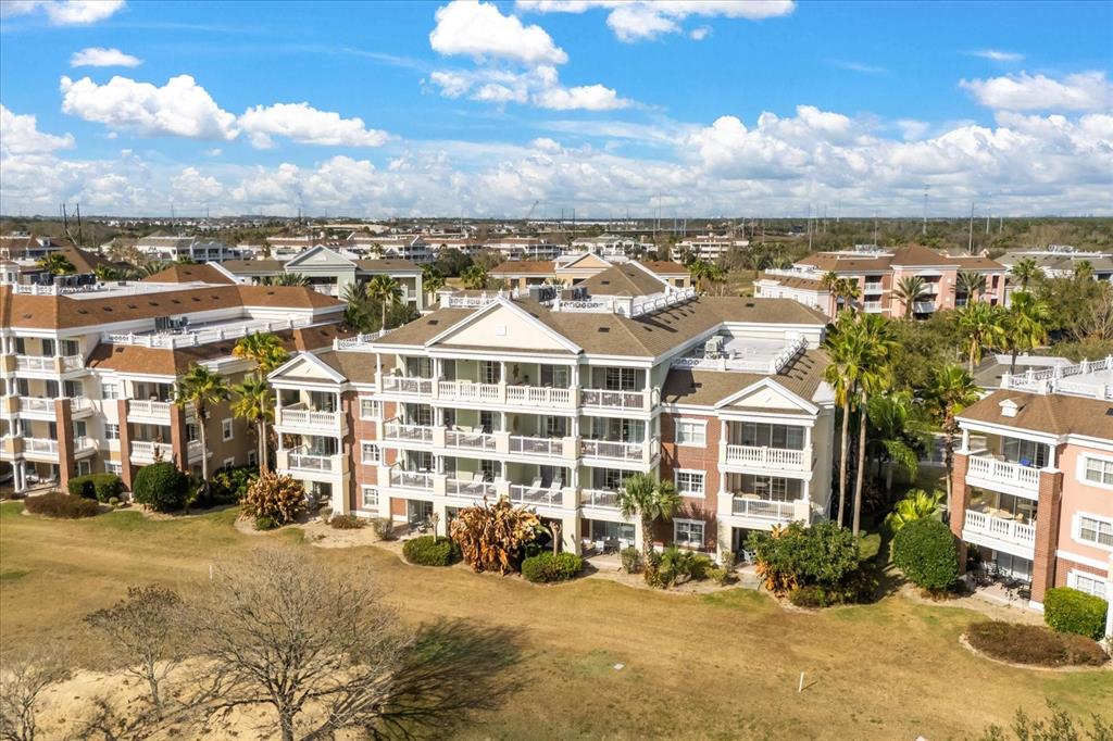 1114 Sunset View Circle, Unit 402 Reunion, FL 34747 - Photo 28 of 32 a view of a city that has tall buildings