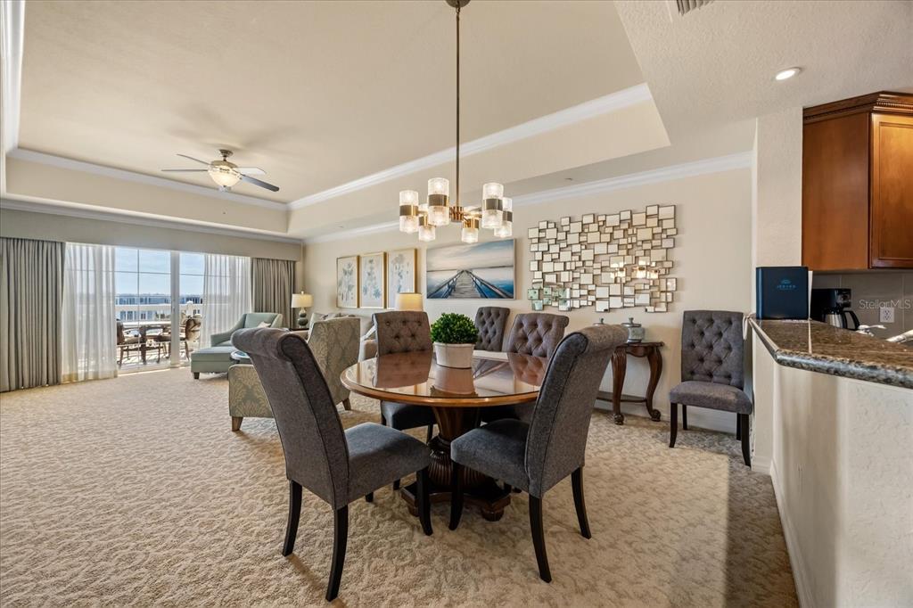 1114 Sunset View Circle, Unit 402 Reunion, FL 34747 - Photo 4 of 32 a view of a dining room with furniture