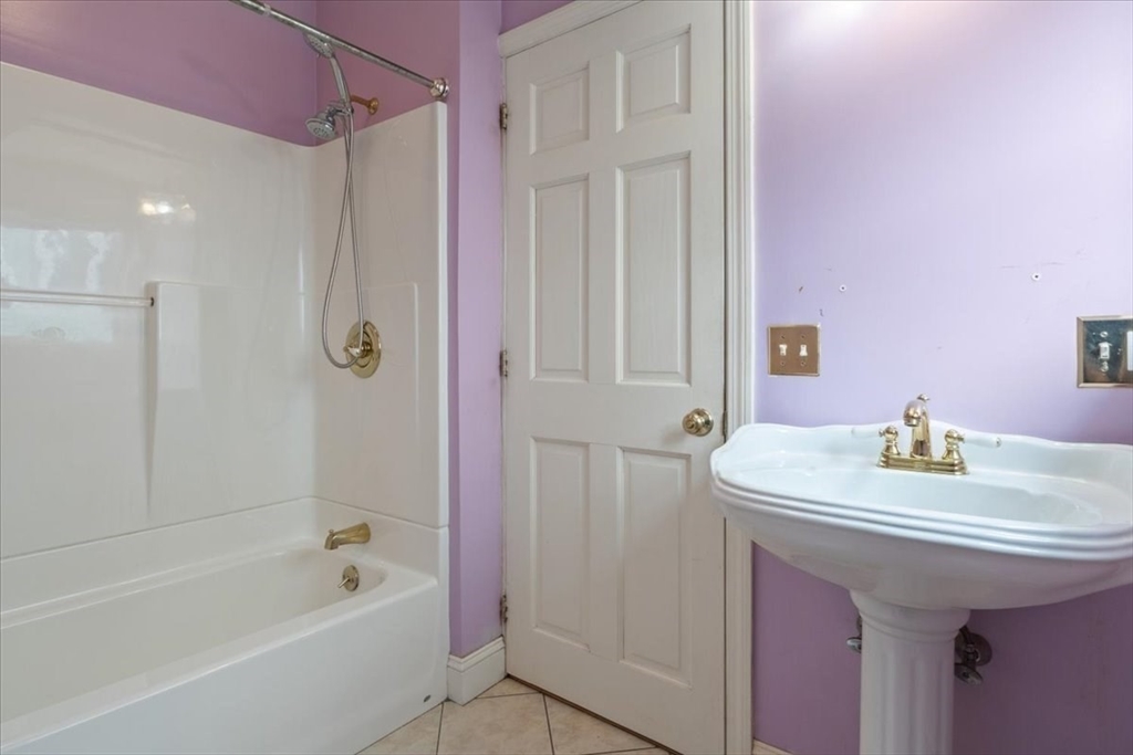 128 Diman Street Fall River, MA 02721 - Photo 12 of 42 a bathroom with a sink vanity tub and shower