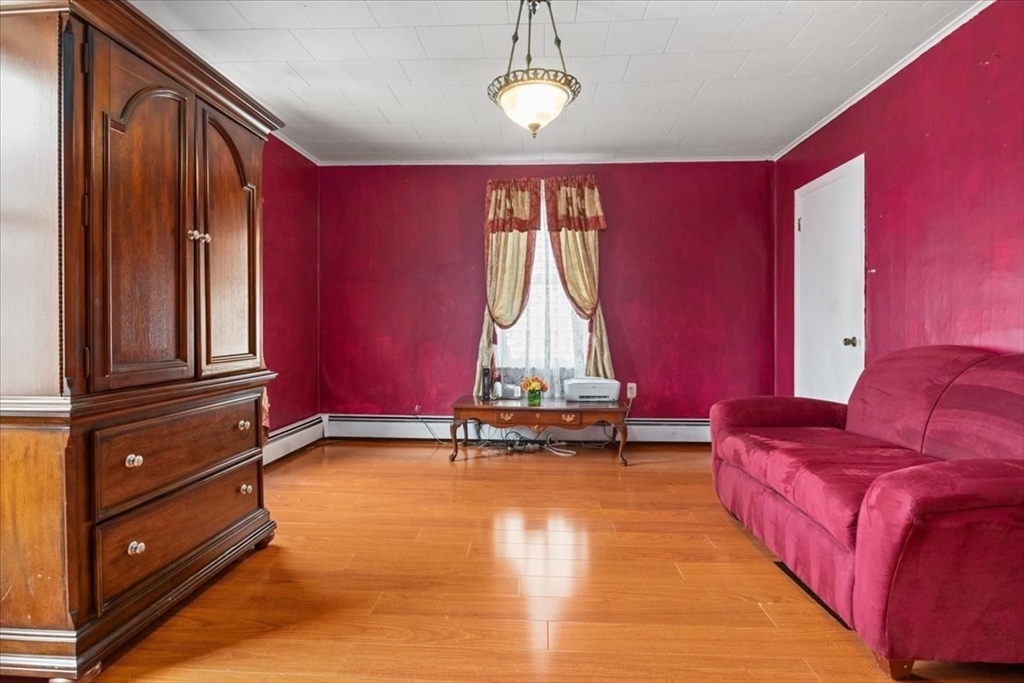 128 Diman Street Fall River, MA 02721 - Photo 14 of 42 a room with furniture and windows