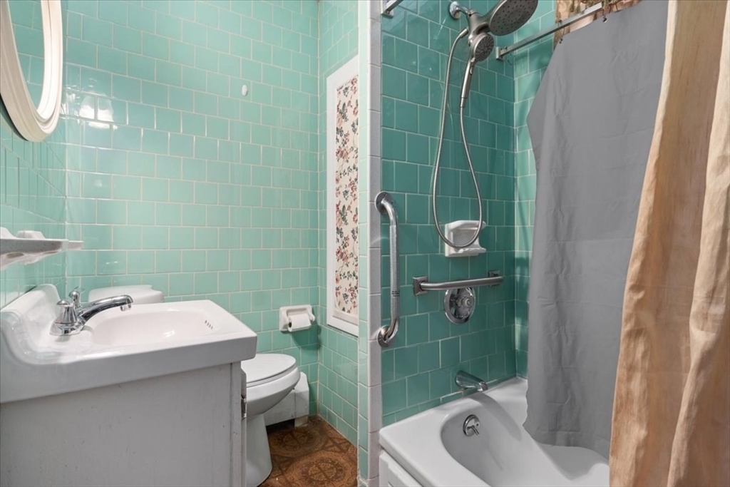 128 Diman Street Fall River, MA 02721 - Photo 20 of 42 a bathroom with a sink a toilet and shower