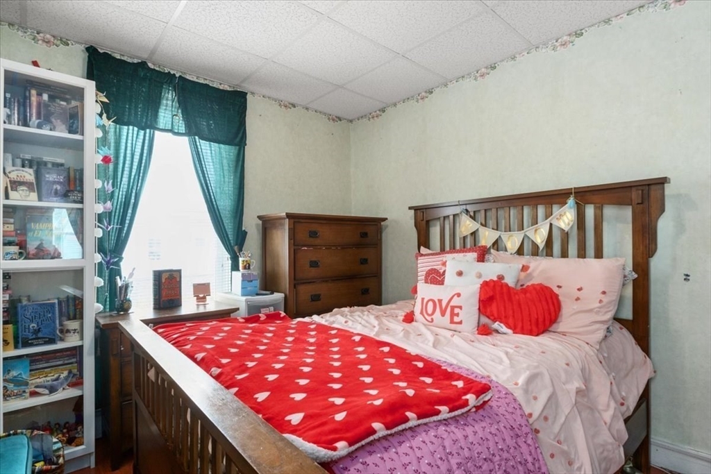 128 Diman Street Fall River, MA 02721 - Photo 22 of 42 a bedroom with a bed and a window