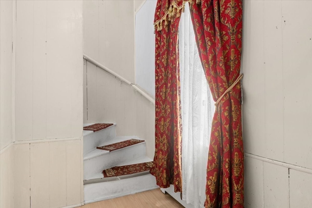 128 Diman Street Fall River, MA 02721 - Photo 24 of 42 a view of walk in closet with clothes and shoes