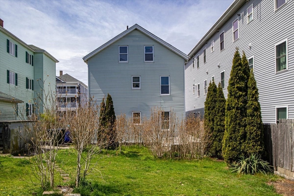 128 Diman Street Fall River, MA 02721 - Photo 4 of 42 a front view of house with yard and green space
