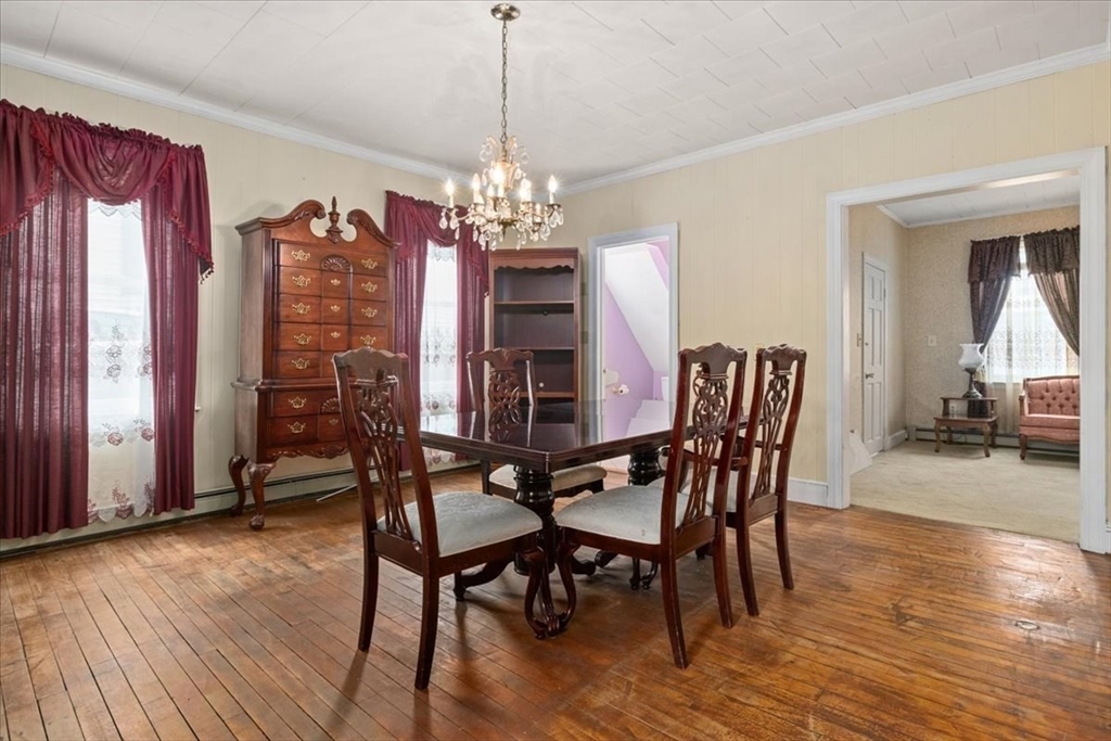 128 Diman Street Fall River, MA 02721 - Photo 7 of 42 a view of a dining room with furniture window and wooden floor