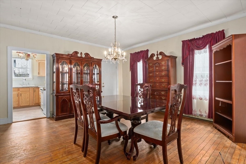 128 Diman Street Fall River, MA 02721 - Photo 8 of 42 a view of a dining room with furniture window and wooden floor