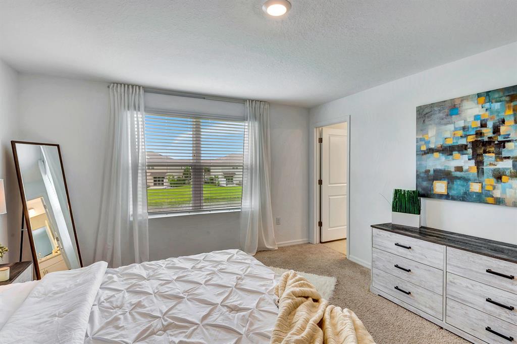 5715 Archipelago Street Nokomis, FL 34275 - Photo 26 of 52 a bedroom with a bed and a window