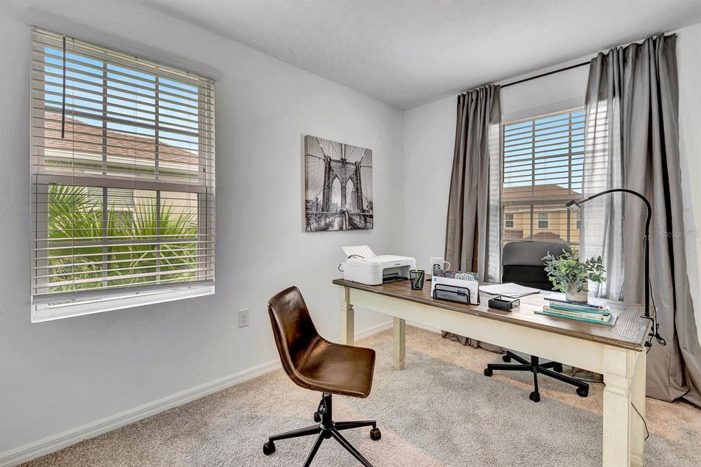 5715 Archipelago Street Nokomis, FL 34275 - Photo 29 of 52 a room with a large window and chair