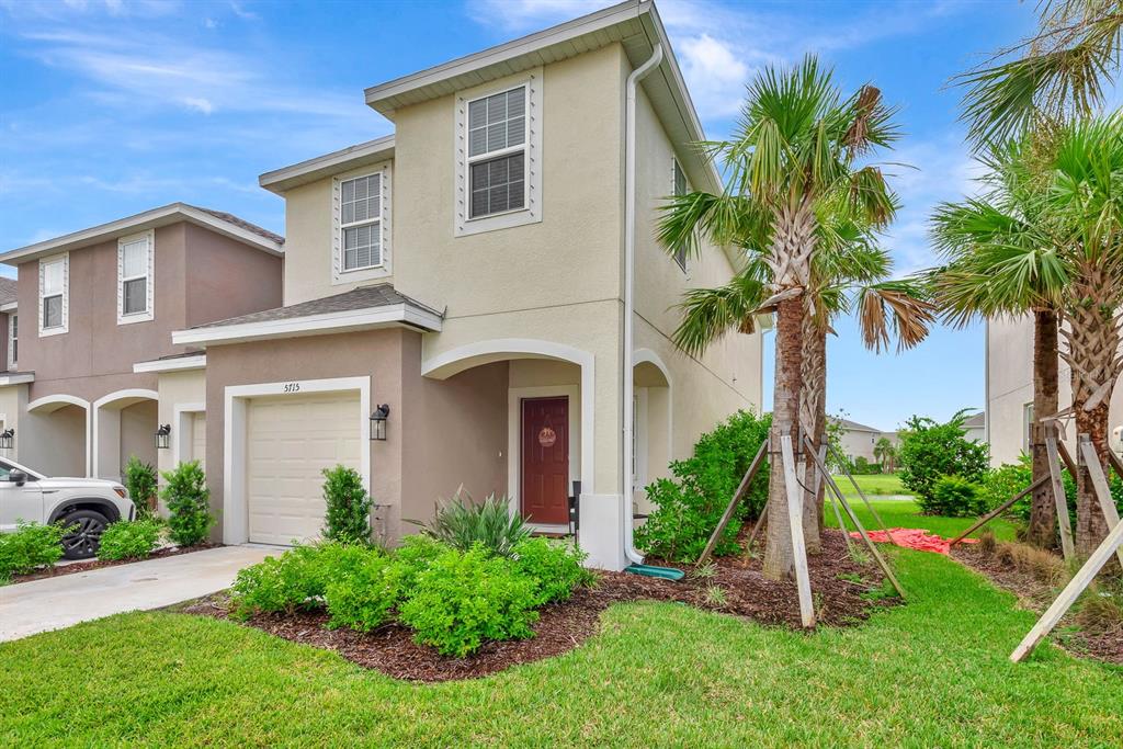 5715 Archipelago Street Nokomis, FL 34275 - Photo 35 of 52 a front view of a house with a garden