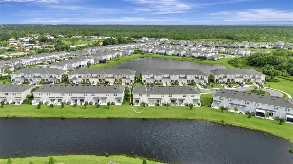 5715 Archipelago Street Nokomis, FL 34275 - Photo 45 of 52 an aerial view of a city with lots of residential buildings ocean and mountain view in back