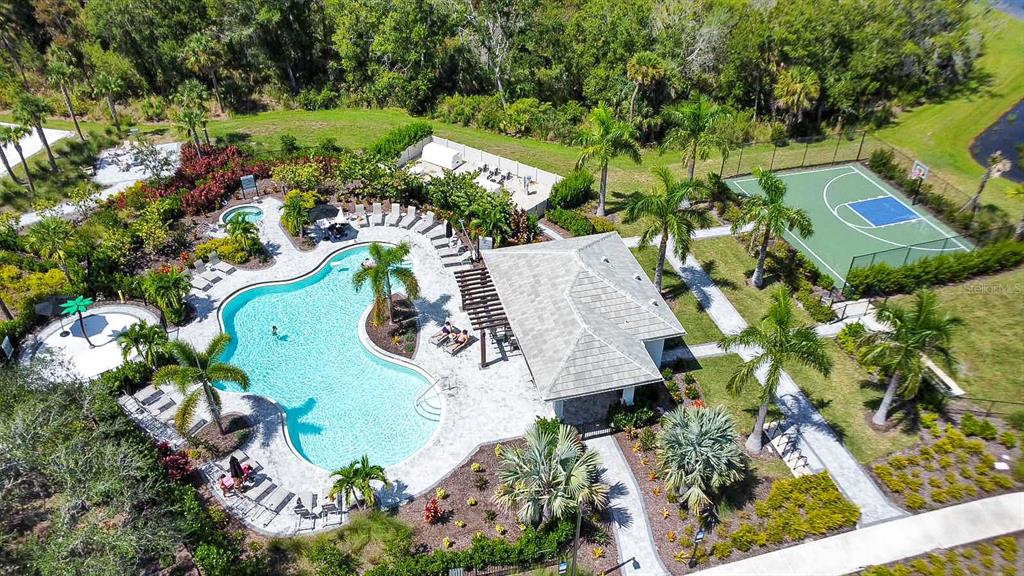 5715 Archipelago Street Nokomis, FL 34275 - Photo 47 of 52 aerial view of a house with a yard and garden