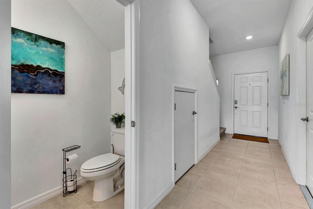 5715 Archipelago Street Nokomis, FL 34275 - Photo 5 of 52 a bathroom with a toilet a sink and garden view
