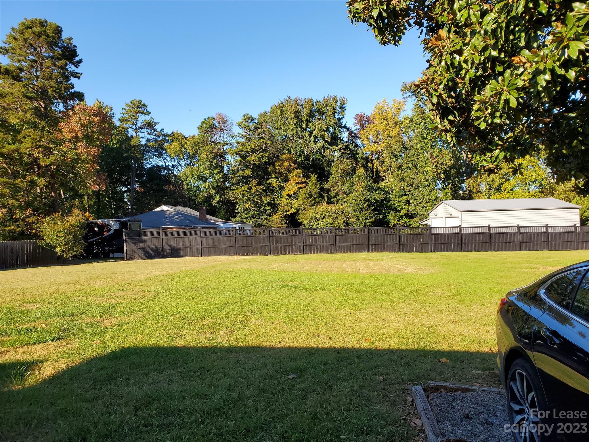 6100 Pleasant Grove Road Charlotte, NC 28216 - Photo 14 of 14 a view of a lake with a big yard