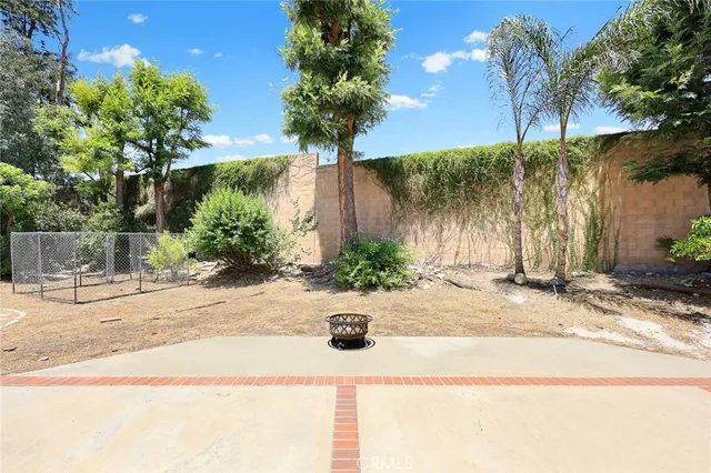 a view of a backyard of the house