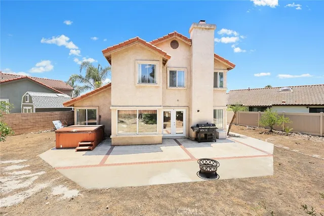 a view of a white house with swimming pool in front of it
