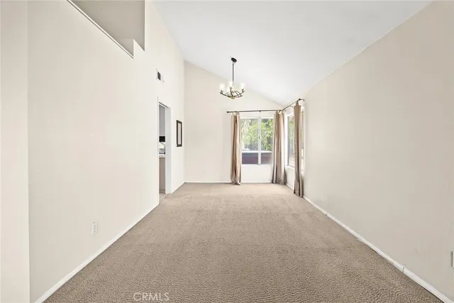 a view of a room with large windows