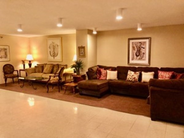 804 Ferncroft Tower, Unit 804 Middleton, MA 01949 - Photo 11 of 33 a living room with furniture and wooden floor