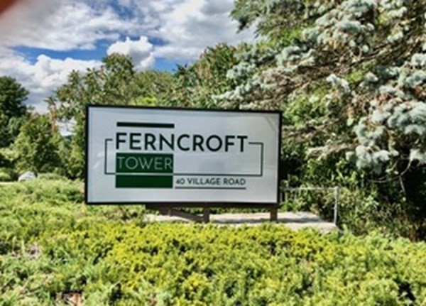 804 Ferncroft Tower, Unit 804 Middleton, MA 01949 - Photo 2 of 33 a sign on the side of a building