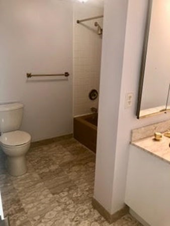804 Ferncroft Tower, Unit 804 Middleton, MA 01949 - Photo 27 of 33 a bathroom with a sink and a toilet
