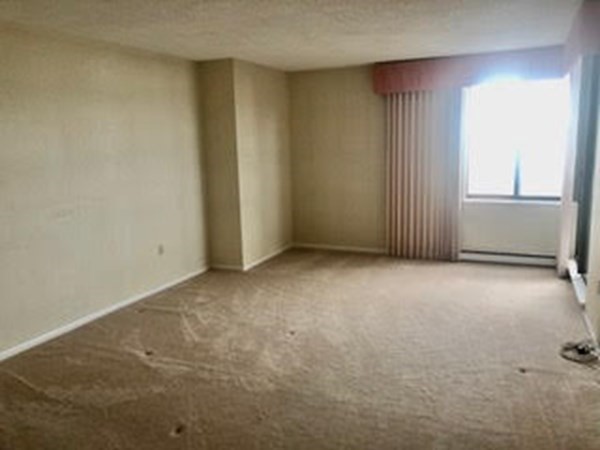 804 Ferncroft Tower, Unit 804 Middleton, MA 01949 - Photo 28 of 33 an empty room with windows