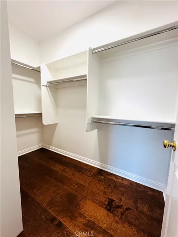 a view of an empty room with a fireplace