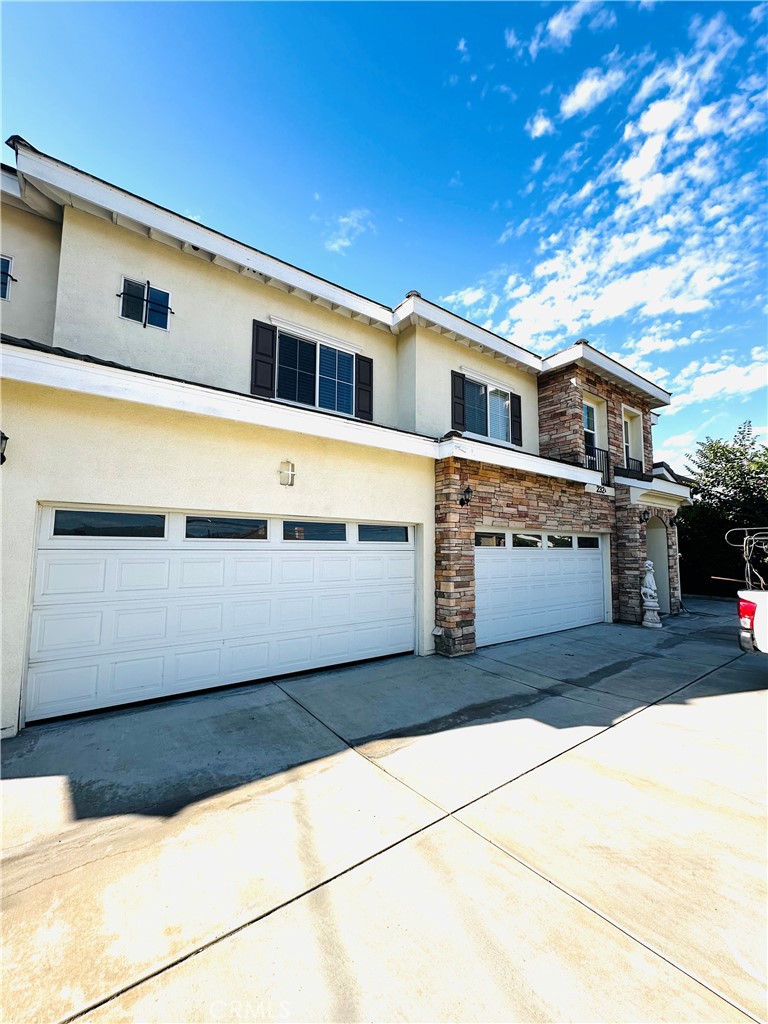 232 Genoa Street, Unit B Arcadia, CA 91006 - Photo 2 of 16 a front view of a house with a garage