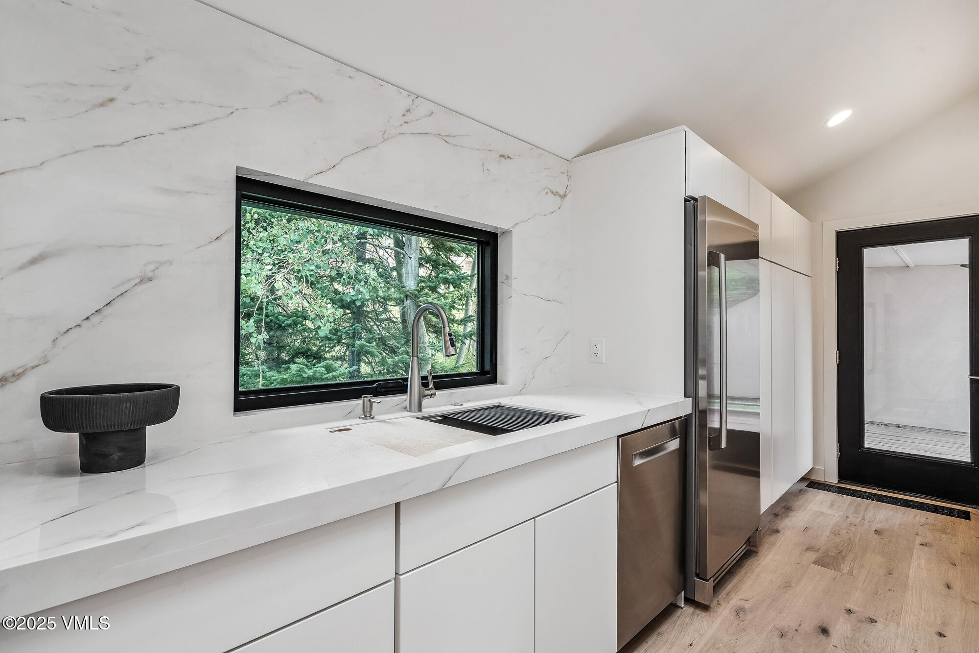 4545 Big Horn Road Vail, CO 81657 - Photo 20 of 49 a kitchen with a sink and a window