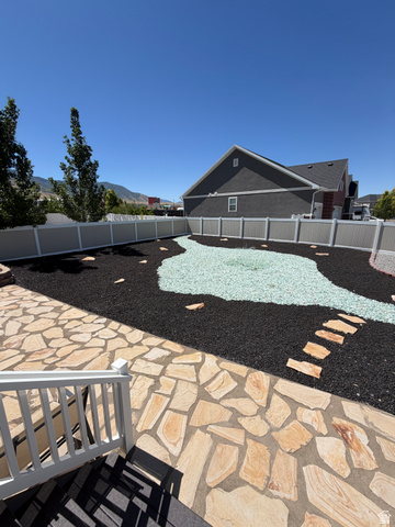 118 Tram Rock Rd. Lake Point, UT 84074 - Photo 28 of 34 Backyard featuring a flagstone patio