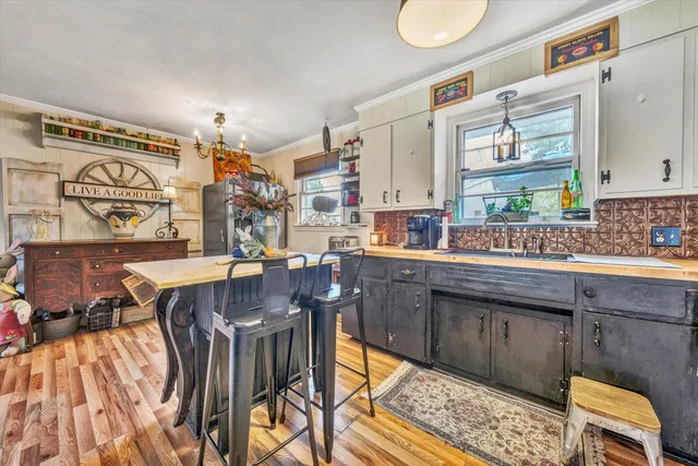 a kitchen with stainless steel appliances granite countertop a sink and cabinets