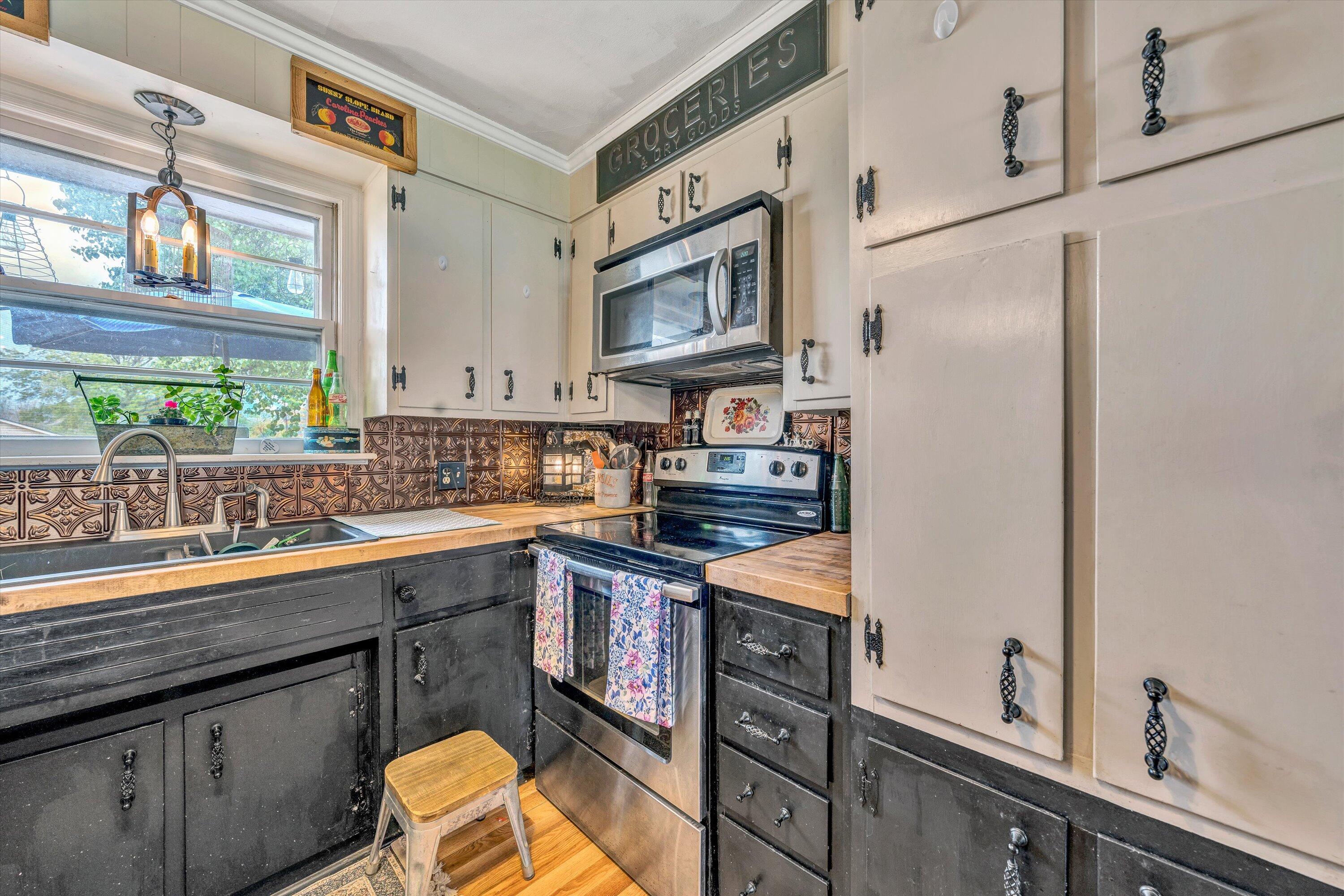 105 Cornell Road Rocky Mount, VA 24151 - Photo 12 of 34 a kitchen with stainless steel appliances granite countertop a sink stove and refrigerator