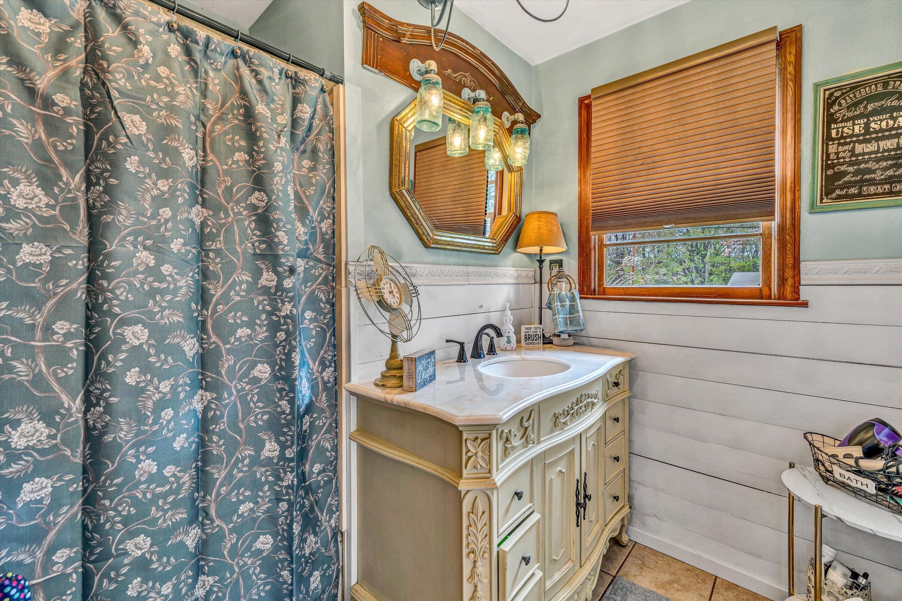 105 Cornell Road Rocky Mount, VA 24151 - Photo 15 of 34 a bathroom with a sink and a mirror