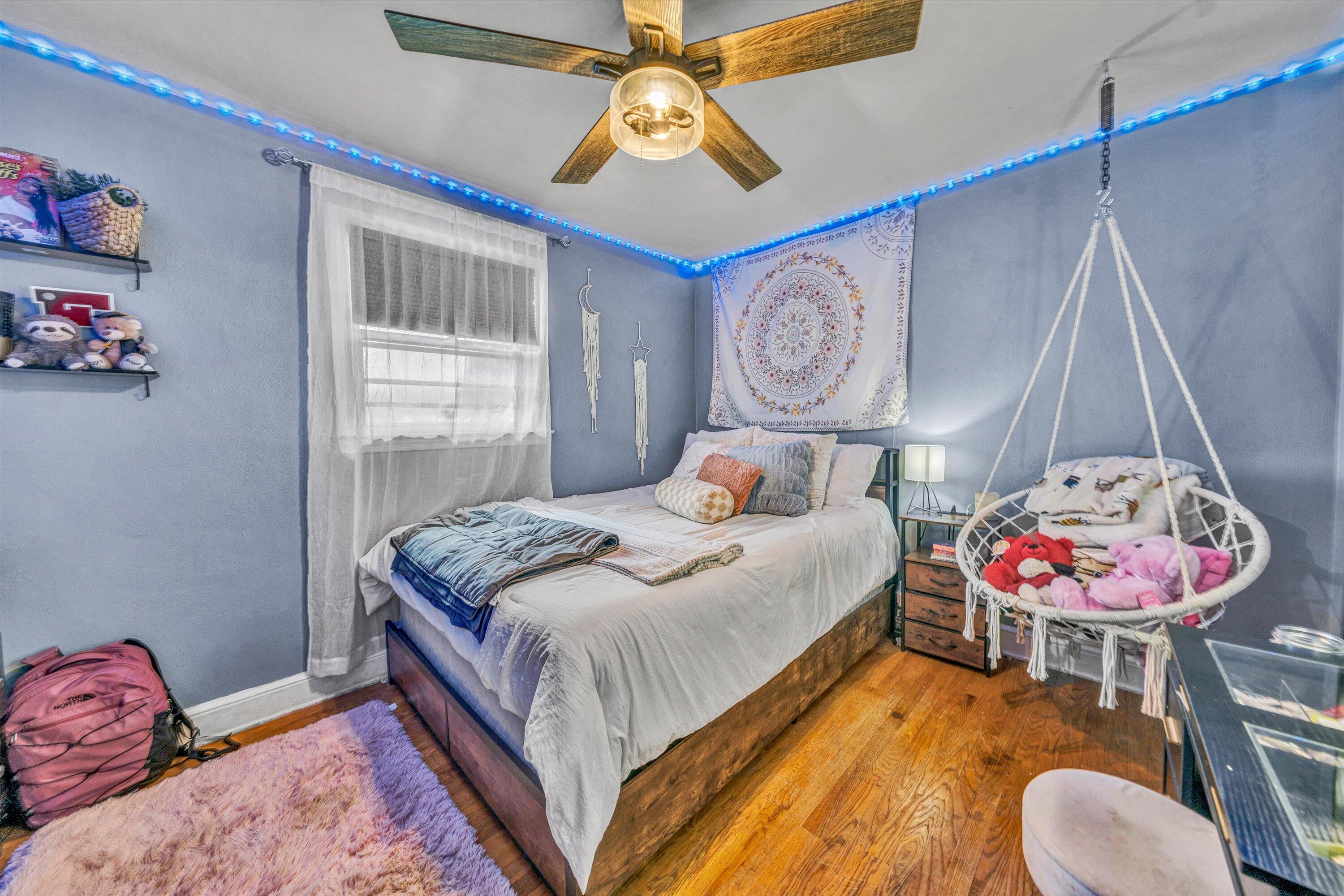 105 Cornell Road Rocky Mount, VA 24151 - Photo 16 of 34 a bedroom with a bed and a chandelier