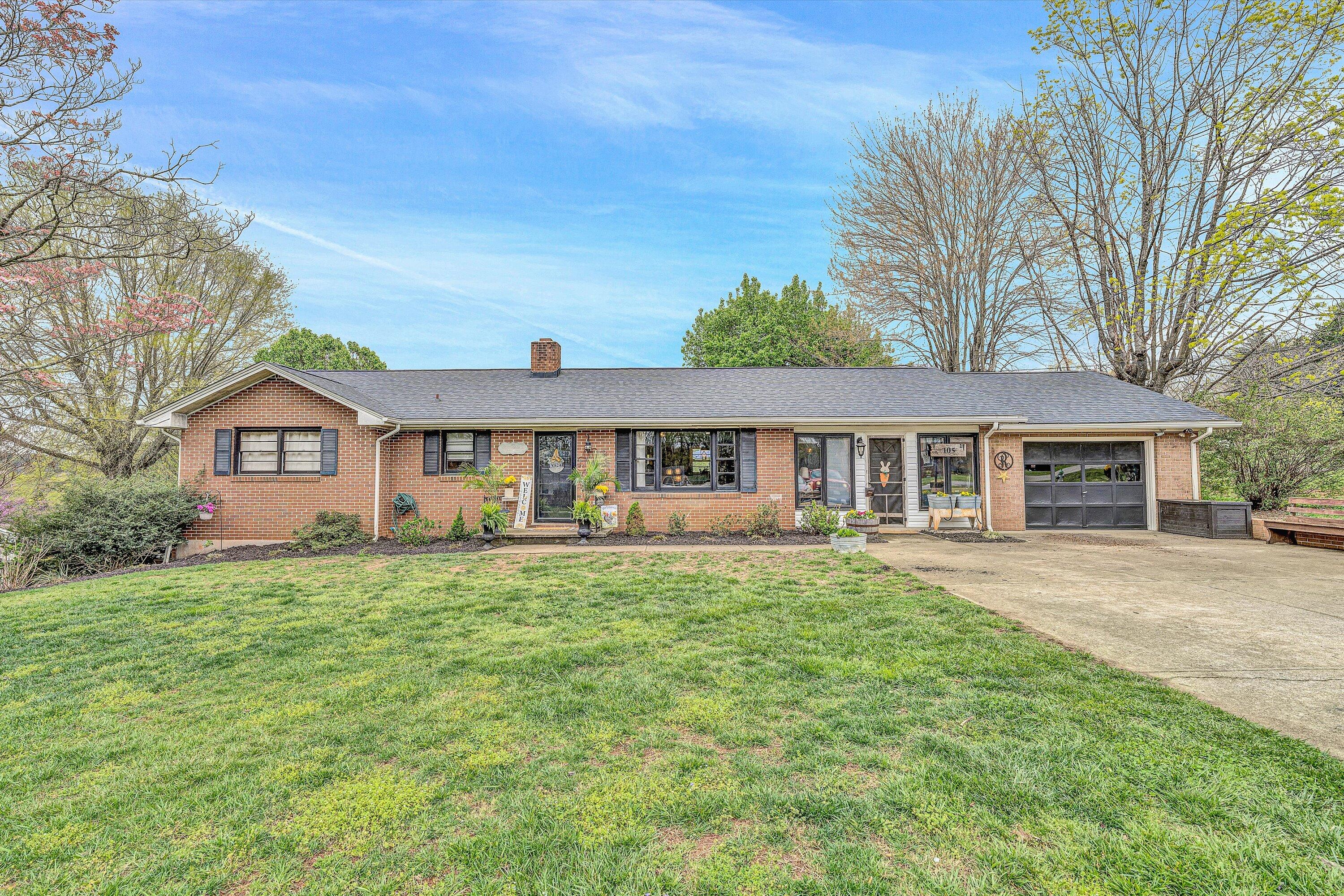 105 Cornell Road Rocky Mount, VA 24151 - Photo 2 of 34 a front view of a house with garden