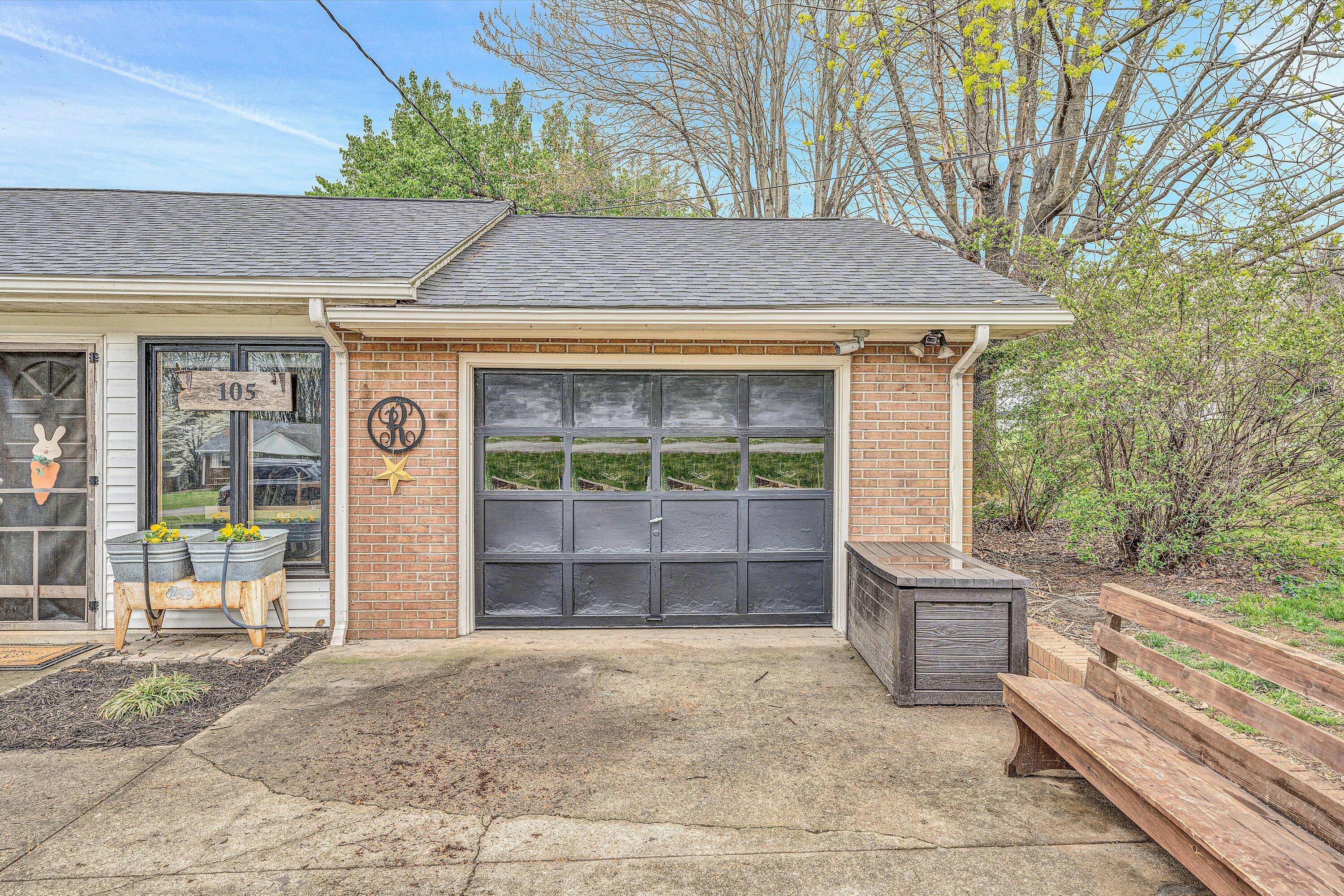 105 Cornell Road Rocky Mount, VA 24151 - Photo 25 of 34 a front view of a house with a yard and garage