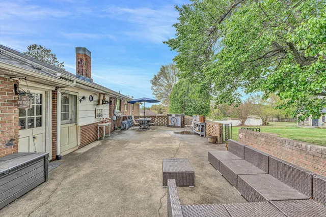 a view of a chairs and table in the patio