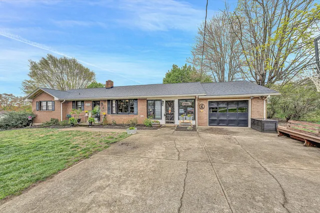 front view of a house with a garden