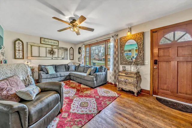 a living room with furniture and a window