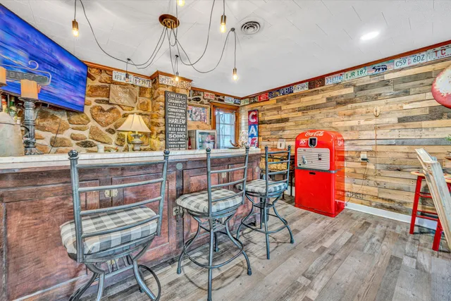 a dining room with furniture and wooden floor