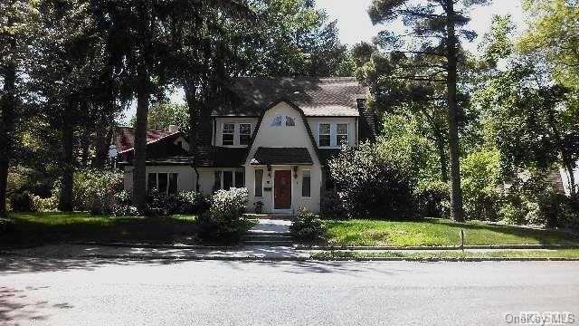 8 Sheffield Road Great Neck, NY 11021 - Photo 1 of 1 front view of house with a small yard